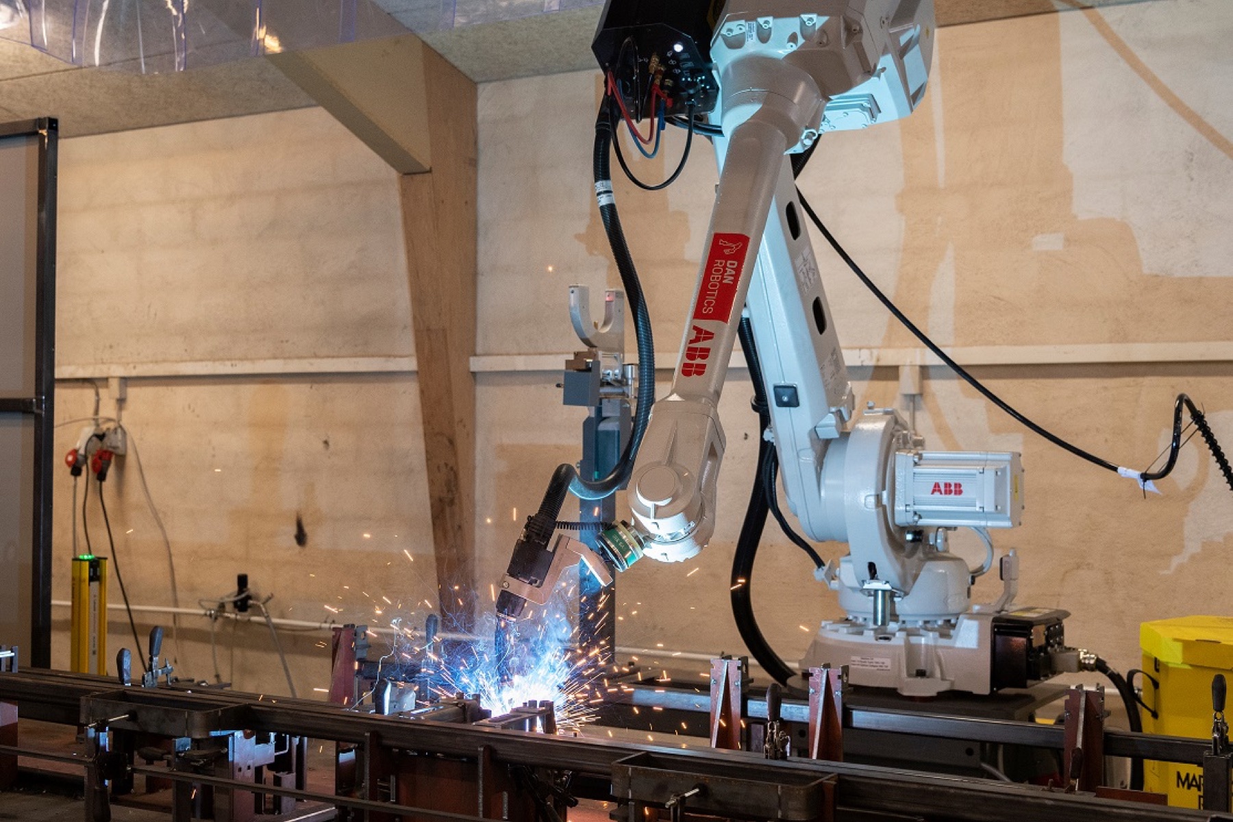 Robot welding production of transport rack components at HF Smede- og Maskinværksted A/S