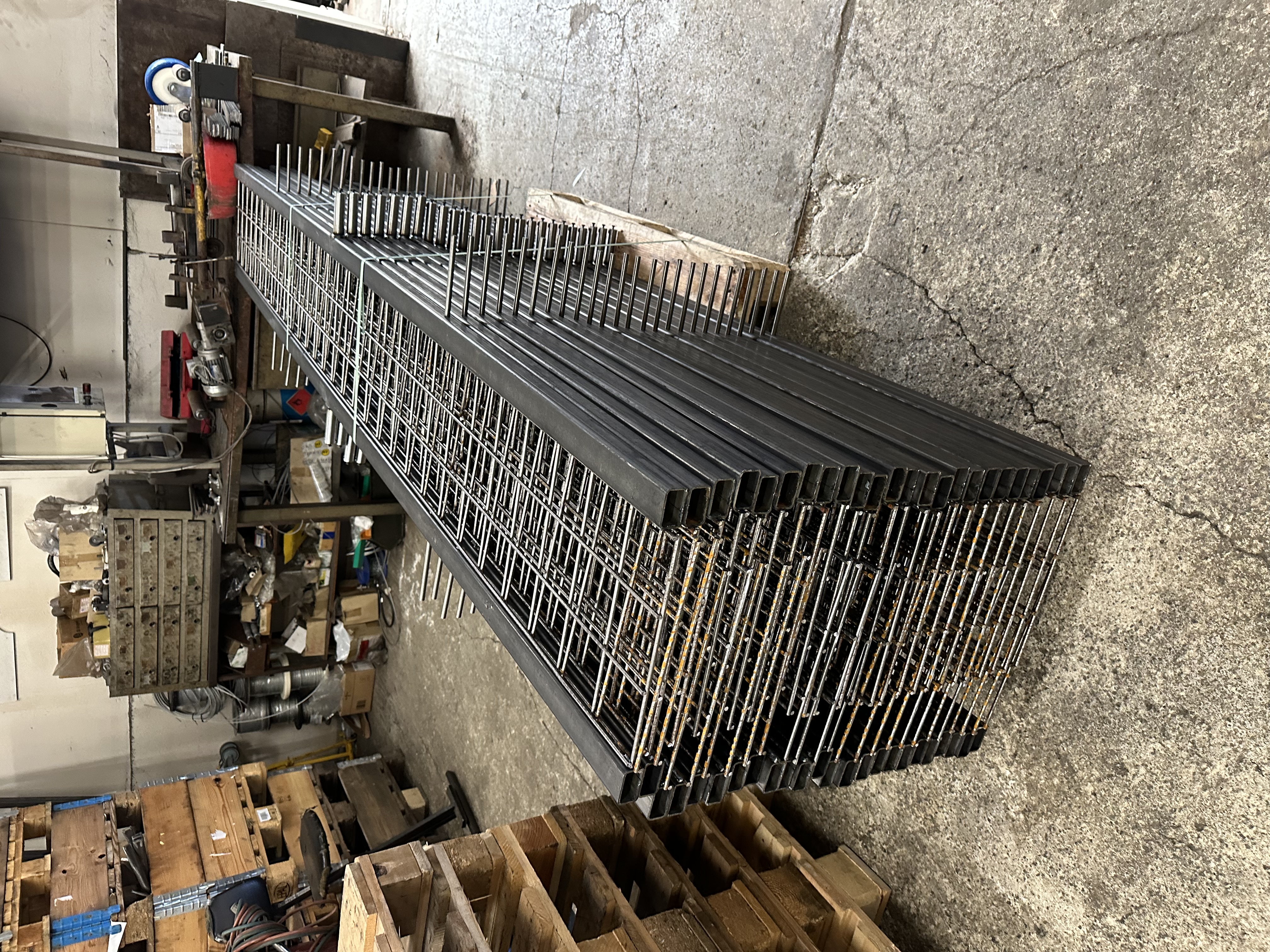 Stack of welded mesh and rod frames in the workshop