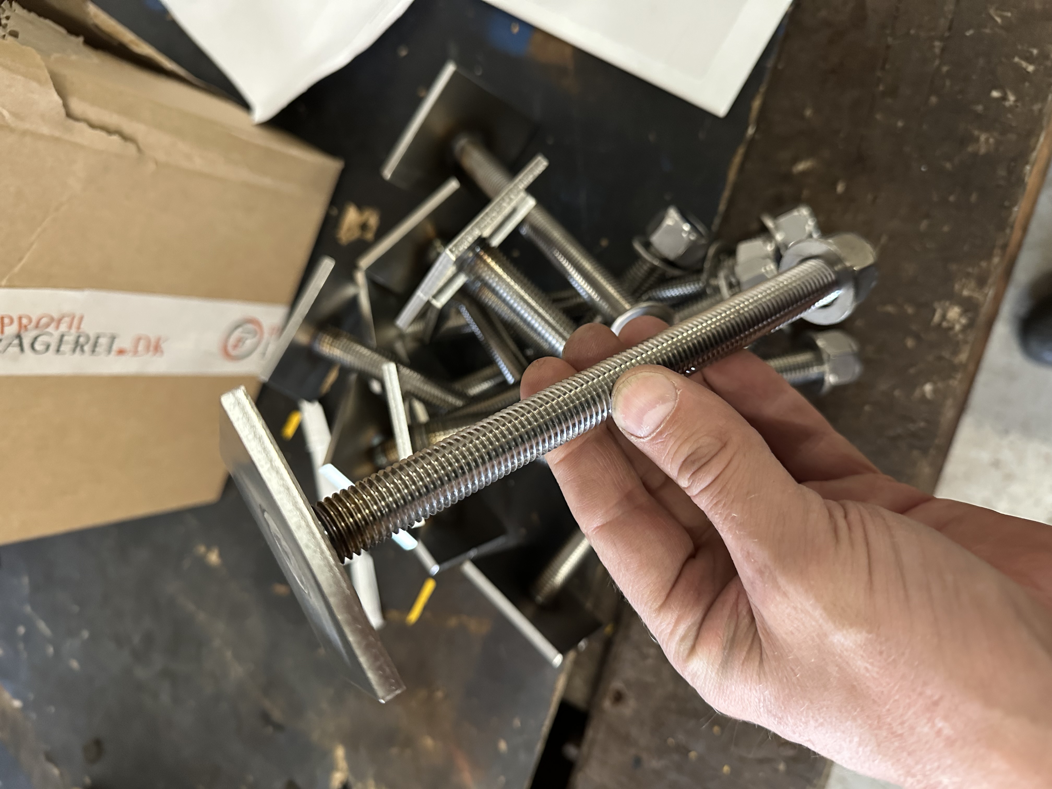 Threaded steel studs and custom plates